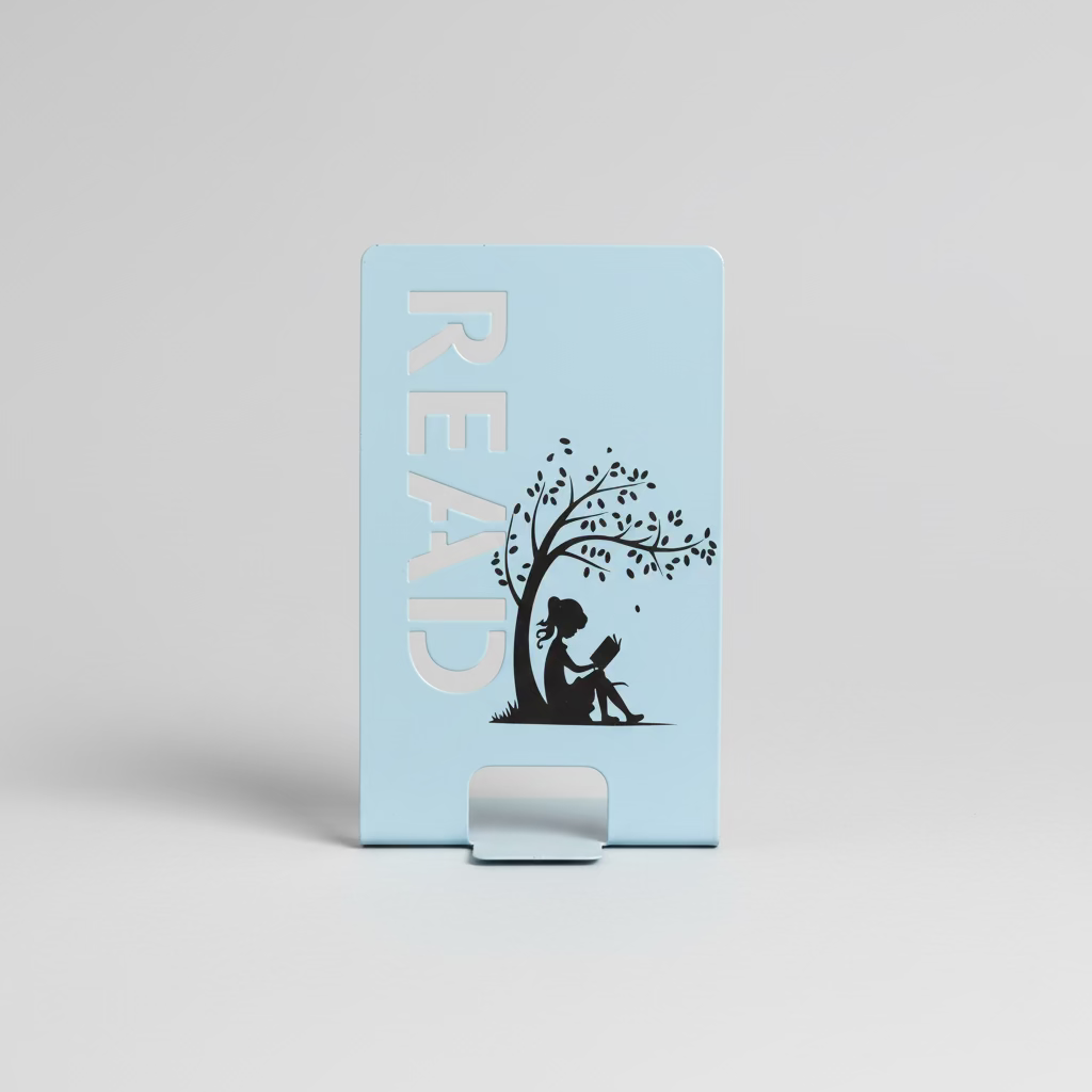 Light blue bookmark with 'READ' and tree design on a bookshelf background