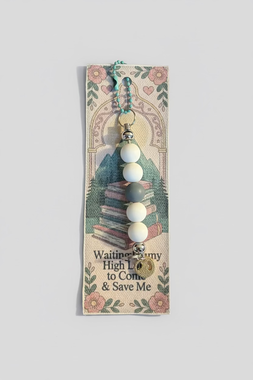 Beaded charm on a decorative card with text