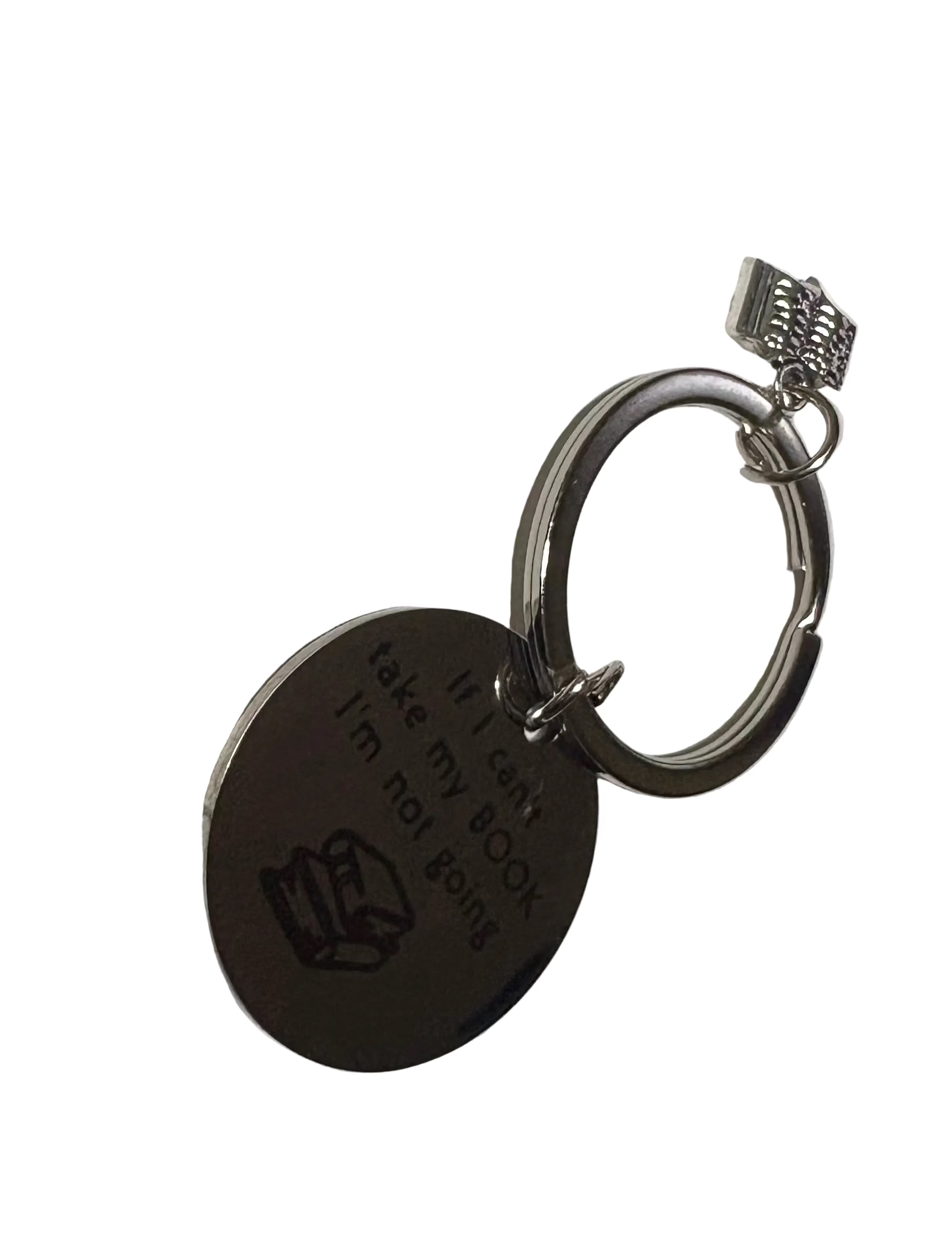 Keychain with engraved text on a light gray background